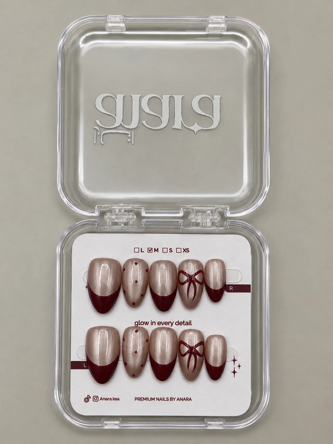 Classic Bow French Press-On Nails — Medium Almond, Ruby Tip — detail view