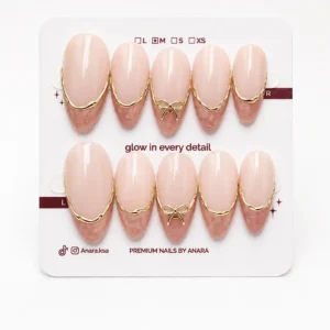 Nude Gold French Bow Press-On Nails — Medium Almond, Gold Bow — ten reusable nails on the ANARA card