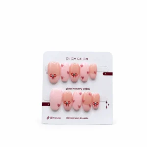 Pink Love Charm Press-On Nails — Short Oval, Heart and Bow — ten reusable nails on the ANARA card