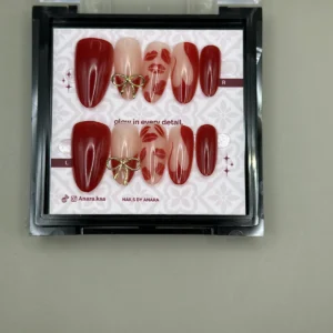 Cherry Ribbon Press-On Nails — Long Almond, Gold Bow — twenty-four nails in the ANARA box